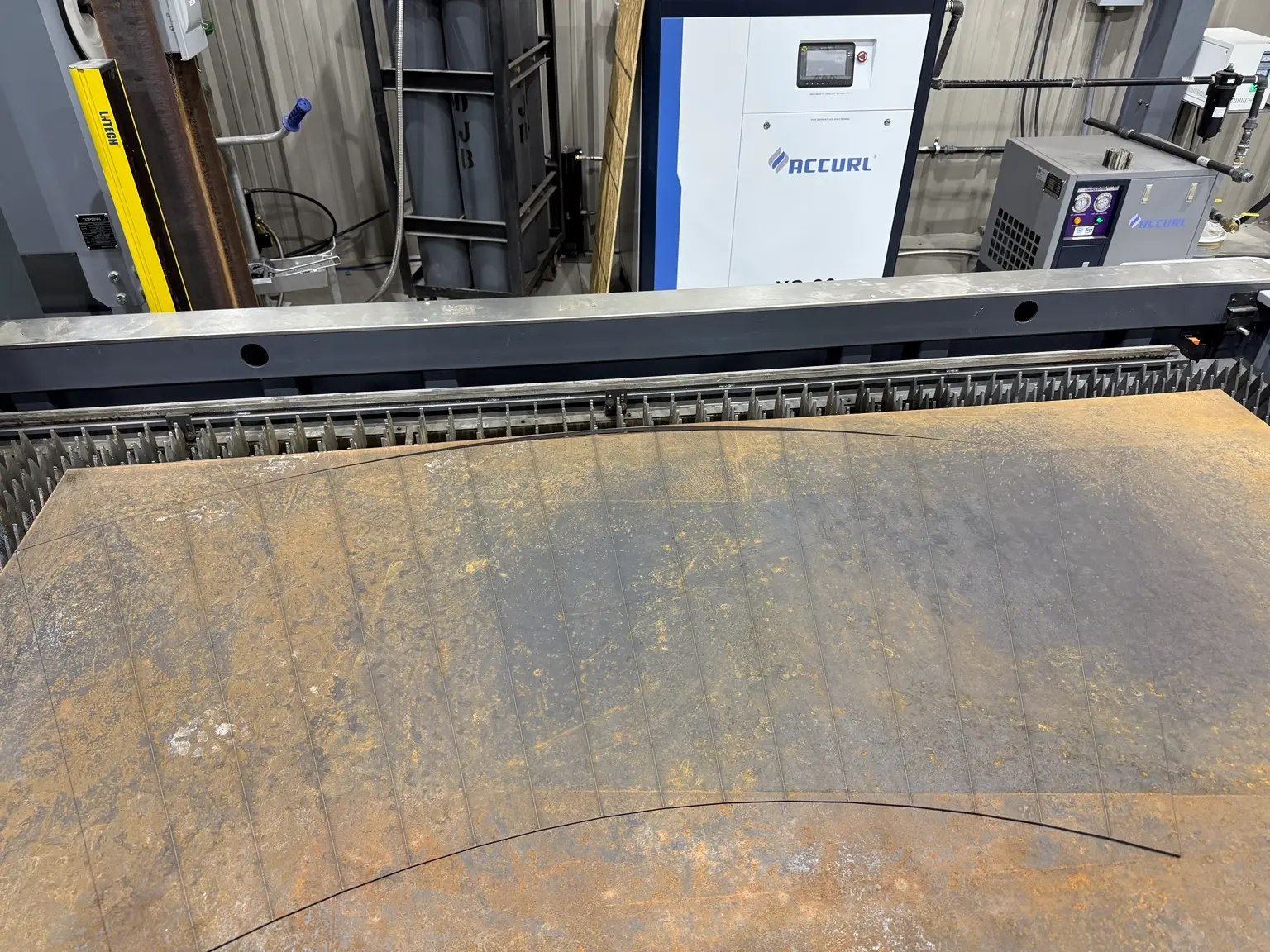 Steel plate being laser cut in our shop